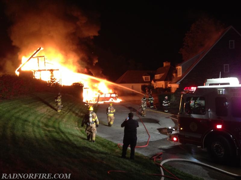 This picture shows how the intense heat was causing the roof to steam on the house located to the right.